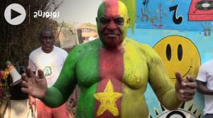 Cover Vidéo - En coulisses avec Ngando Pickett, la star des supporters du Cameroun 